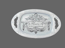 Load image into Gallery viewer, A blue trinket tray with a decorative fluer transfer.
